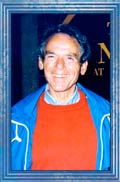photo - headshot: William "Bill" Thetford wearing red sweater, blue jacket