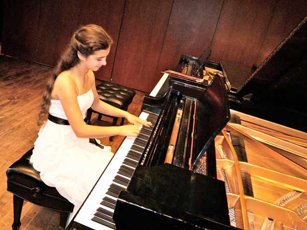 photo: Alzena Ilie - award winning pianist, playing piano